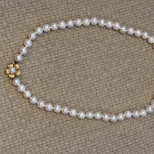 15 1/2 " long Classic single strand of white round pearls-14K gold flower clasp